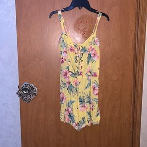 Flower Yellow Jumper or Romper.From Hollister.Girls Large.Can tighten in chest.